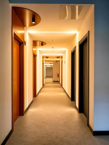 a corridor of an office building with a long hallway at Wonder Hostel in Toledo