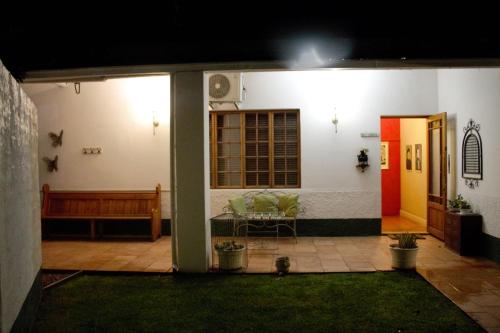 a house with a table in the front of it at Lockerbie Lodge in Vryburg