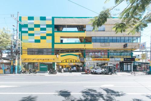 a colorful building on a city street at RedDoorz near SM City Muntinlupa in Manila