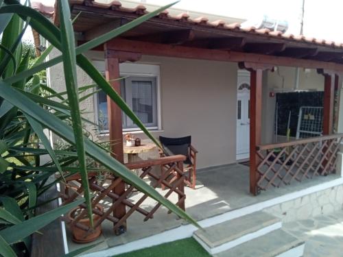 a view of a patio with a pergola at The Garden Studio in Kriopigi