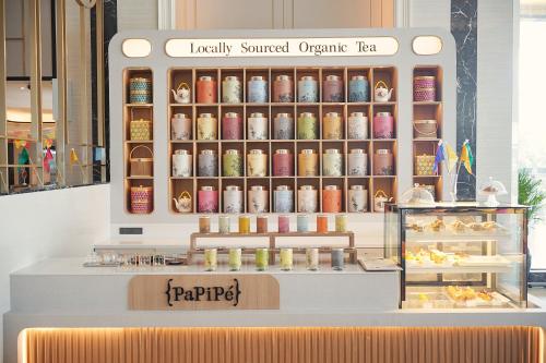 a store with a display case filled with food at Siam Mandarina Hotel - Free BKK Airport Shuttle in Lat Krabang