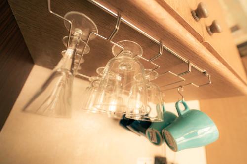 a group of glass bottles hanging on a wall at MolinHotels407 アクティビティを満喫できる札幌定山渓温泉付き別荘-1L1Room K-Bed1&S-bed3 5persons in Jozankei