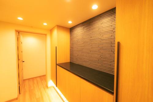 Televisyen dan/atau pusat hiburan di MolinHotels702 アクティビティを満喫できる札幌定山渓 天然温泉付-1L2Room K-Bed1&W-beds3 8persons