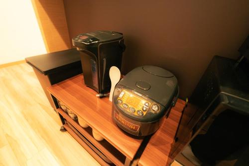Kemudahan buat kopi dan teh di MolinHotels702 アクティビティを満喫できる札幌定山渓 天然温泉付-1L2Room K-Bed1&W-beds3 8persons
