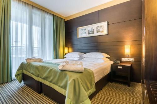 Ένα ή περισσότερα κρεβάτια σε δωμάτιο στο Best Western Plus Olives City Hotel - Free Pool & Parking