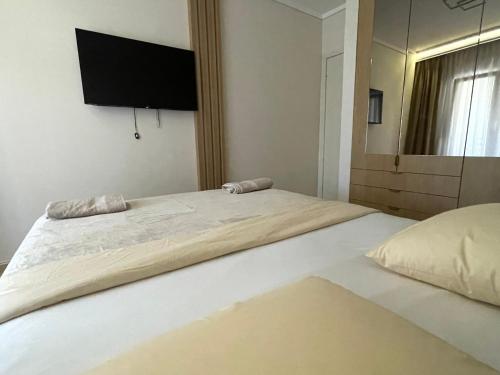Ένα ή περισσότερα κρεβάτια σε δωμάτιο στο Fterna Apartment