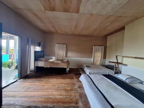 Postel nebo postele na pokoji v ubytování Smiley's Homestay