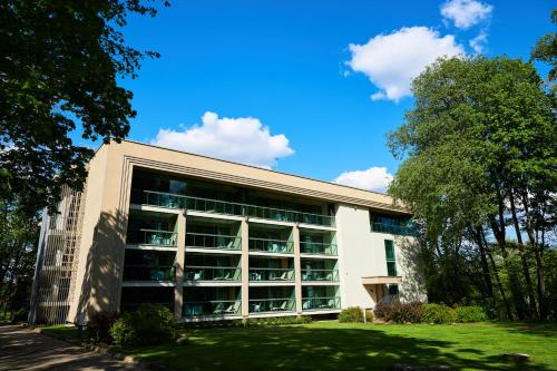 a large building with a lot of windows at Grand SPA Lietuva Serviced Apartments Dzūkija in Druskininkai