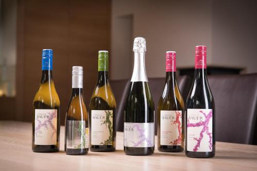 four bottles of wine sitting on a table at Weingut Familie Bauer in Großriedenthal