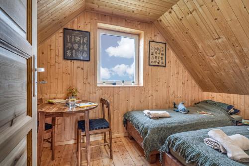 Postel nebo postele na pokoji v ubytování Domek wczasowy z dostępem do Mini zoo Donkeyszot