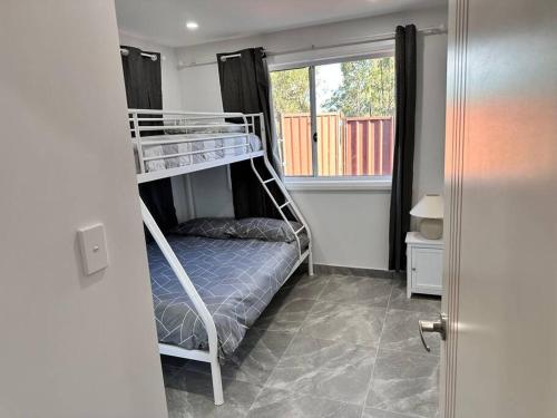 Postel nebo postele na pokoji v ubytování Woodbine Guesthouse