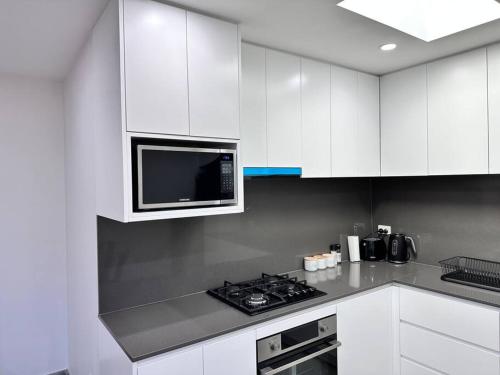 Kuchyň nebo kuchyňský kout v ubytování Woodbine Guesthouse