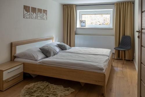 Postel nebo postele na pokoji v ubytování Apartmány Mýtinka - Jeseníky
