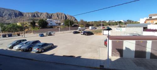 a group of cars parked in a parking lot at Apartamento Saul in Beniarbeig