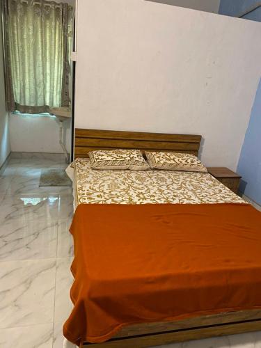 a bed sitting in a bedroom with at Sonchafa Stays in Nagaon