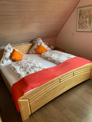 a bedroom with a large bed with pillows on it at Ferienwohnung Rockenbach in Pünderich