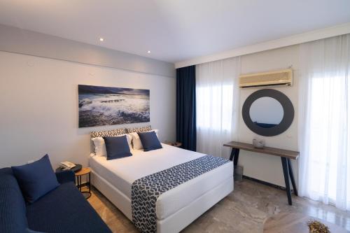 Katil atau katil-katil dalam bilik di Akti Hotel & Apartments