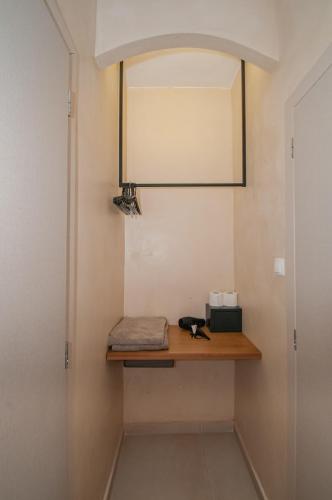 a cat sitting on a shelf in a hallway at Atma Beach Rooms & Suites in Faliraki