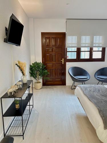 Μια τηλεόραση ή/και κέντρο ψυχαγωγίας στο Apartamentos Val de Comillas
