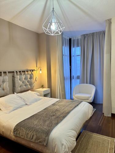 Ένα ή περισσότερα κρεβάτια σε δωμάτιο στο Apartamentos Val de Comillas