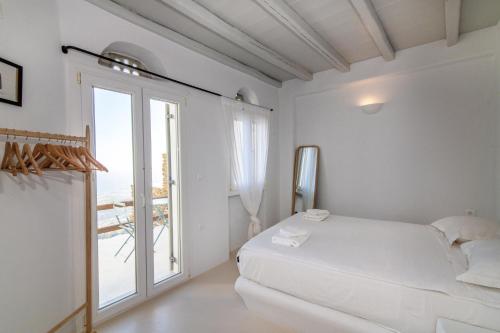Ένα ή περισσότερα κρεβάτια σε δωμάτιο στο Giagermos House