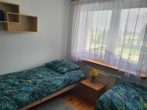 Un ou plusieurs lits dans un hébergement de l'établissement Pokoje Krosno