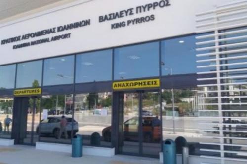a car dealership with two glass doors with a truck at Nikola's apartments_King Pyrros in Palio Limani