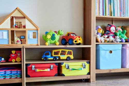 a book shelf filled with lots of toys at Chata Harmonie in Bedřichov
