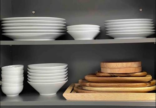 a bunch of plates and bowls on a shelf at The Ball House in Daegu