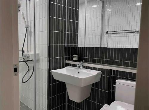 a bathroom with a sink and a toilet at The Ball House in Daegu