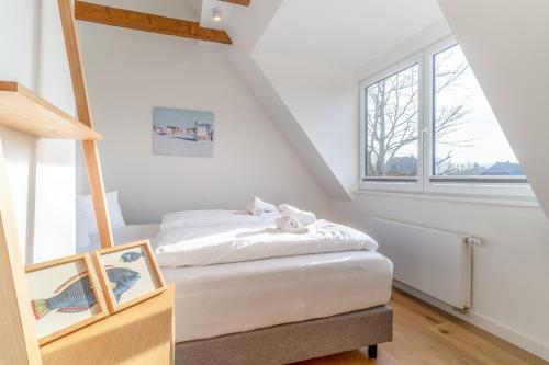 Ένα ή περισσότερα κρεβάτια σε δωμάτιο στο Ferienhaus Seapoint direkt bei St Peter-Ording