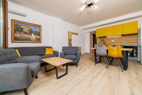 a living room with a couch and a table at Beach Apartments Center in Crikvenica