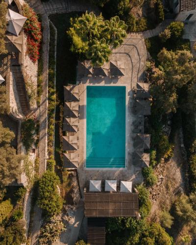 an overhead view of a swimming pool in a resort at Finca Serena Mallorca, Small Luxury Hotels in Montuiri