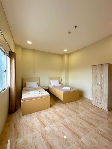 Ένα ή περισσότερα κρεβάτια σε δωμάτιο στο THE VELVET SUITES AND HOTEL