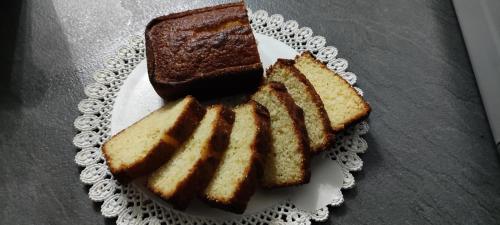 a plate with three slices of bread on it at Sa Burra Guest House in Gadoni