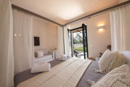 Giường trong phòng chung tại Casale degli Ulivi by Apulia Hospitality