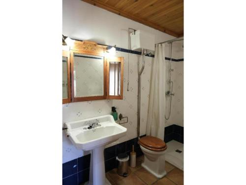 a bathroom with a sink and a toilet at Casa Rural Cal Caminer in Guimerá