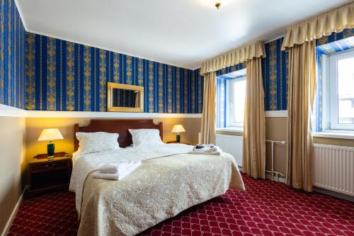 Кровать или кровати в номере Milling Hotel Plaza