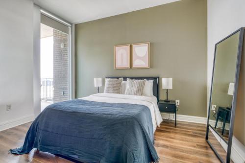 a bedroom with a large bed with a blue blanket at Downtown Austin 1br w gym pool wd nr Capitol ATX-109 in Austin