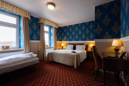 Кровать или кровати в номере Milling Hotel Plaza