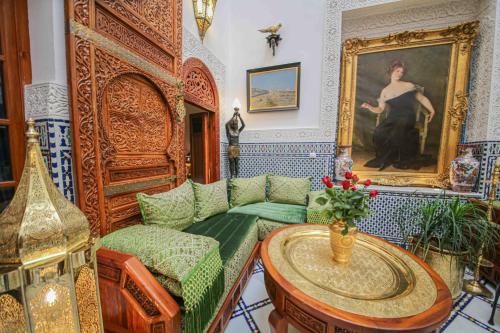 a living room with a couch and a table at Dar Dalila Fes in Fès