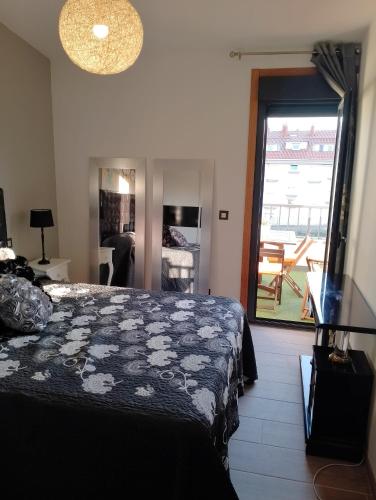 En eller flere senge i et værelse på Ático VistasMar (Castiñeiras-Ribeira)