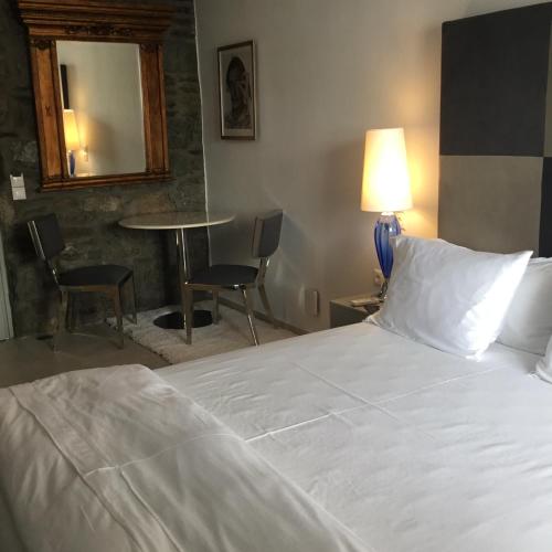 Ένα ή περισσότερα κρεβάτια σε δωμάτιο στο Greco Philia Hotel Boutique