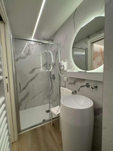 a bathroom with a shower and a sink and a mirror at Best Western Park Hotel Continental in San Donà di Piave