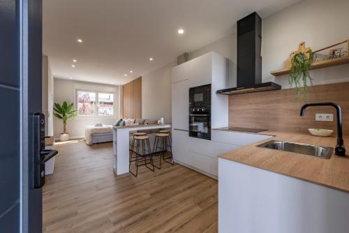 a kitchen with a sink and a counter top at Loft White Tree by Arca Jazmin in O Pedrouzo