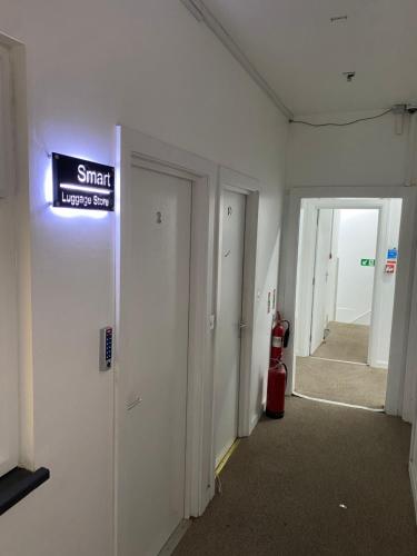 a hallway in a building with a sign on the wall at Smart Luggage Store in London