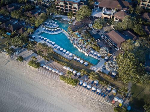 an aerial view of a resort with a marina at Pullman Phuket Panwa Beach Resort in Panwa Beach