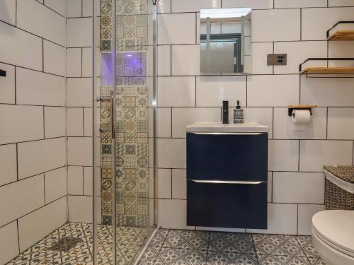 a bathroom with a sink and a toilet at The Cloud Apartment 2 in Chester