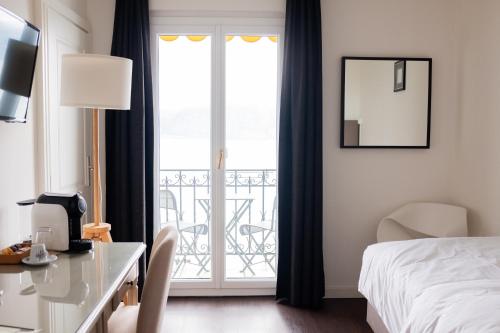 Baron Tavernier Hotel Restaurant & SPAにあるベッド