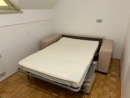 a hospital bed sitting in a corner of a room at Studio 68 Terme Čatež in Brežice